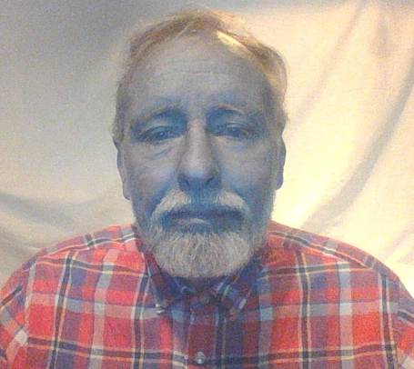 A person with a beard and mustache

AI-generated content may be incorrect.